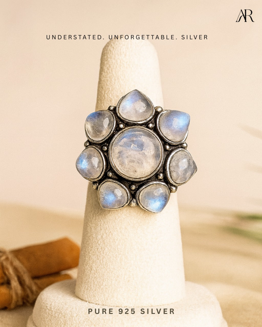 Sterling silver Moonlight Bloom statement ring with central moonstone and petal accents – AplusR Jewelry