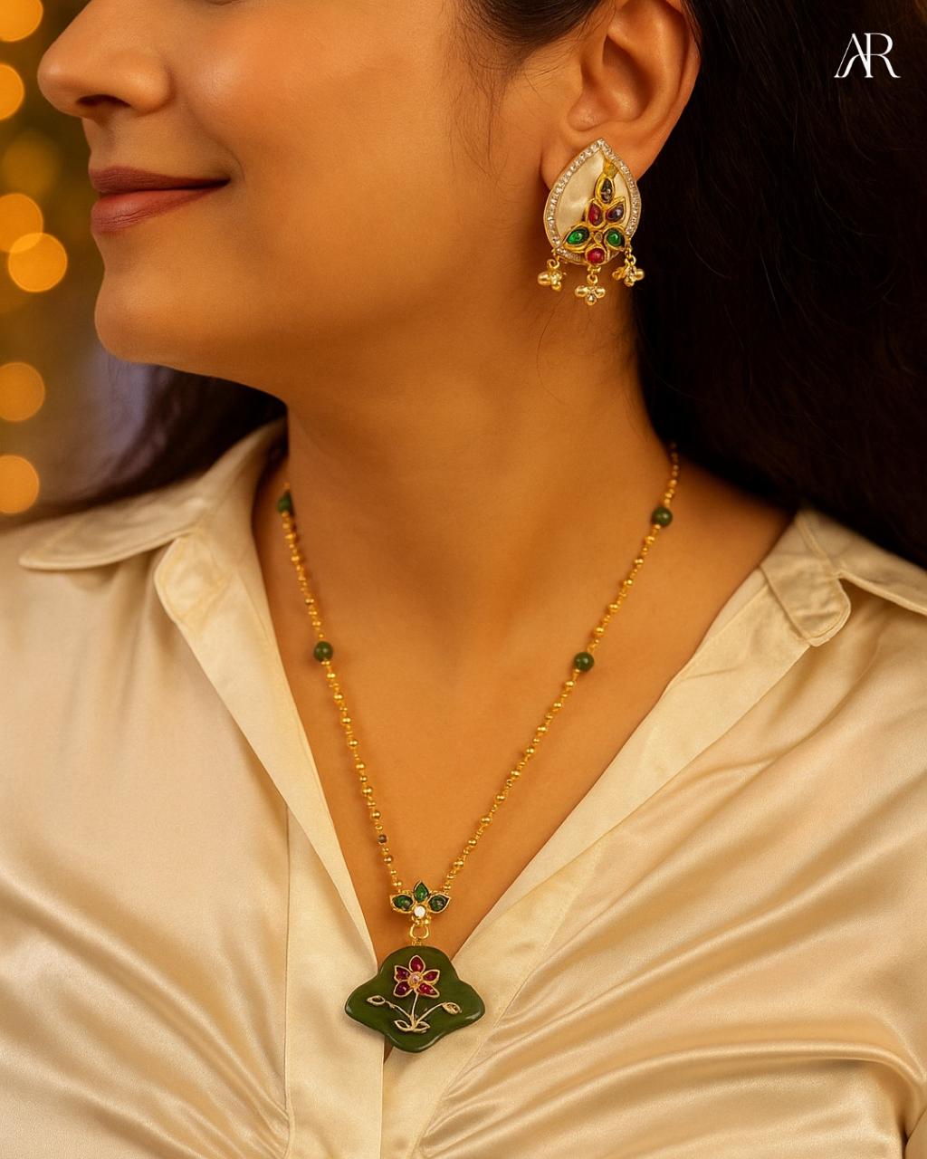 Sterling silver Verdant Bloom pendant necklace with green stone, gold-tone chain, and floral enamel design – AplusR Jewelry”