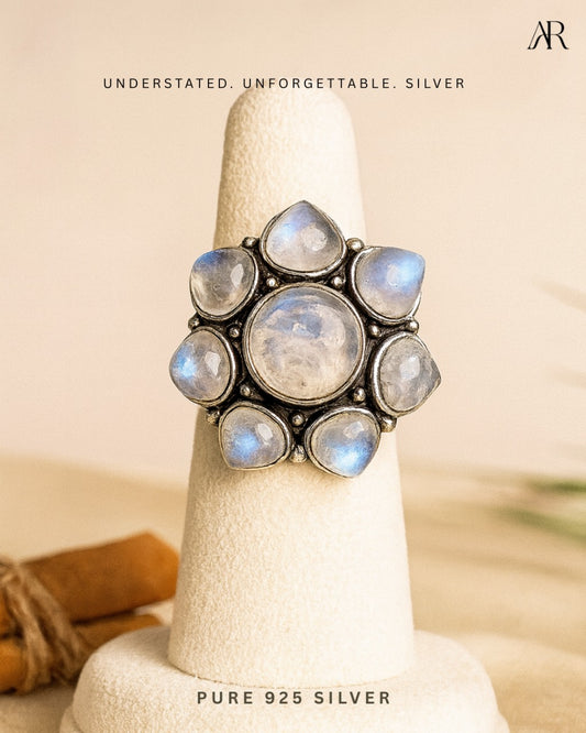 Sterling silver Moonlight Bloom statement ring with central moonstone and petal accents – AplusR Jewelry